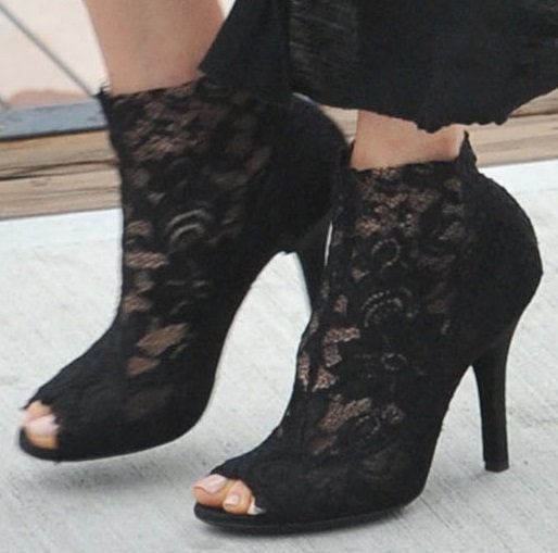 Maggie Q shows off her chic black lace peep-toe booties with a perfectly polished nude pedicure