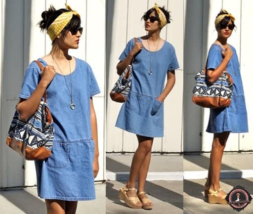 Ashley teams her plain denim dress with a headscarf, printed tote, and wedge sandals
