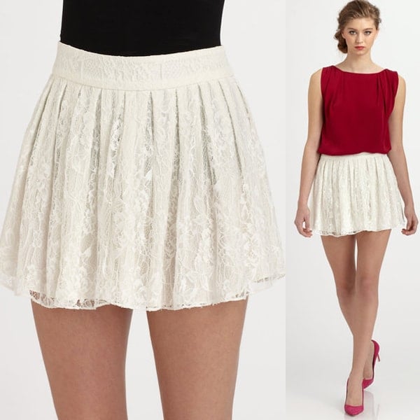 Detail of the Alice + Olivia 'Rei' lace mini skirt, highlighting its intricate lace design and elegant box pleats
