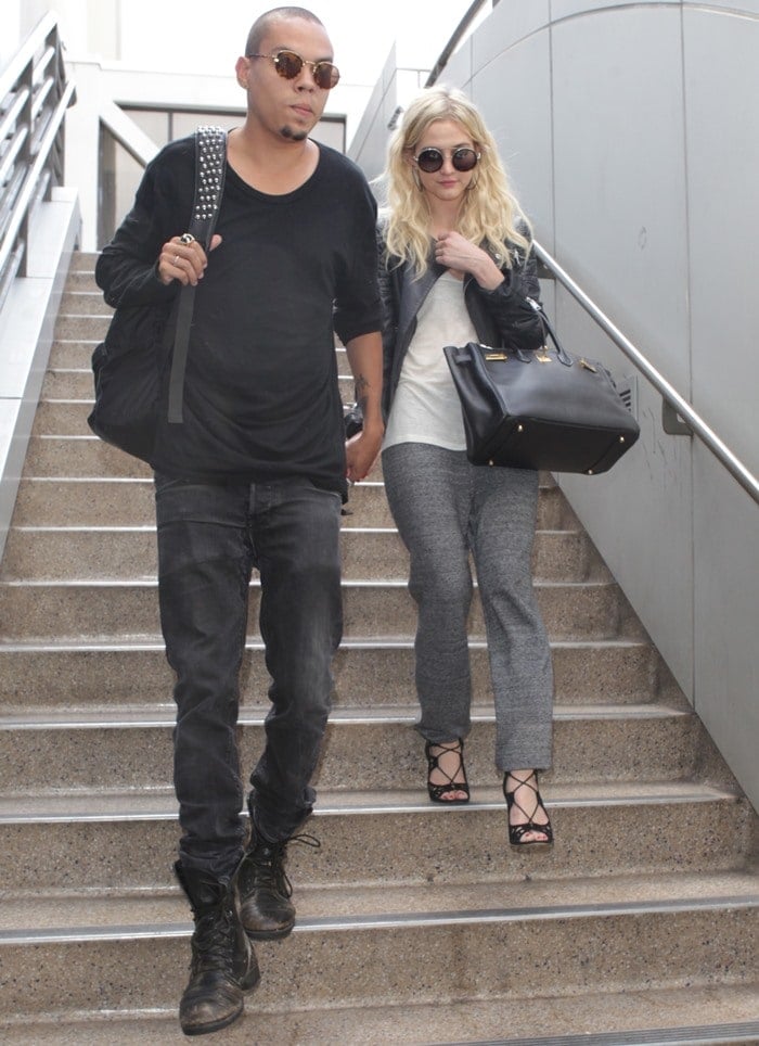 Ashlee Simpson and Evan Ross arrive together holding hands at LAX in Los Angeles, California, on July 31, 2013