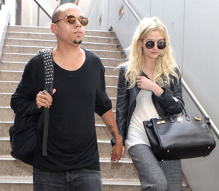 Ashlee Simpson and Evan Ross arrive together holding hands at LAX in Los Angeles, California, on July 31, 2013