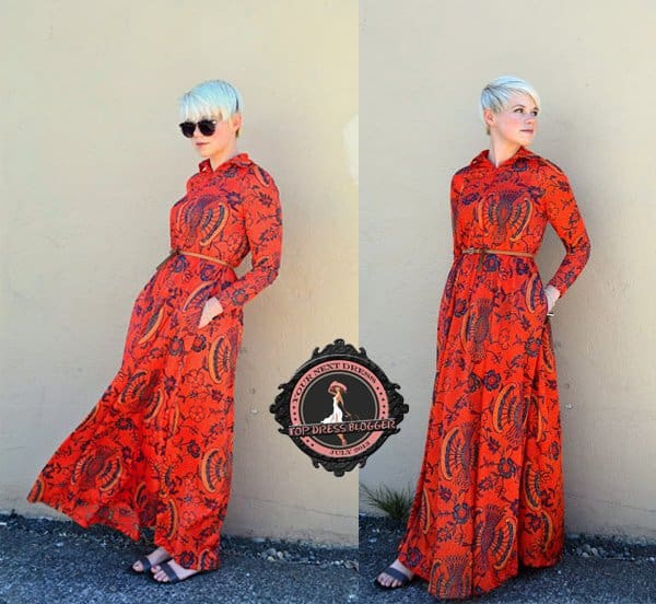 Catie stands out in a bright orange printed maxi dress