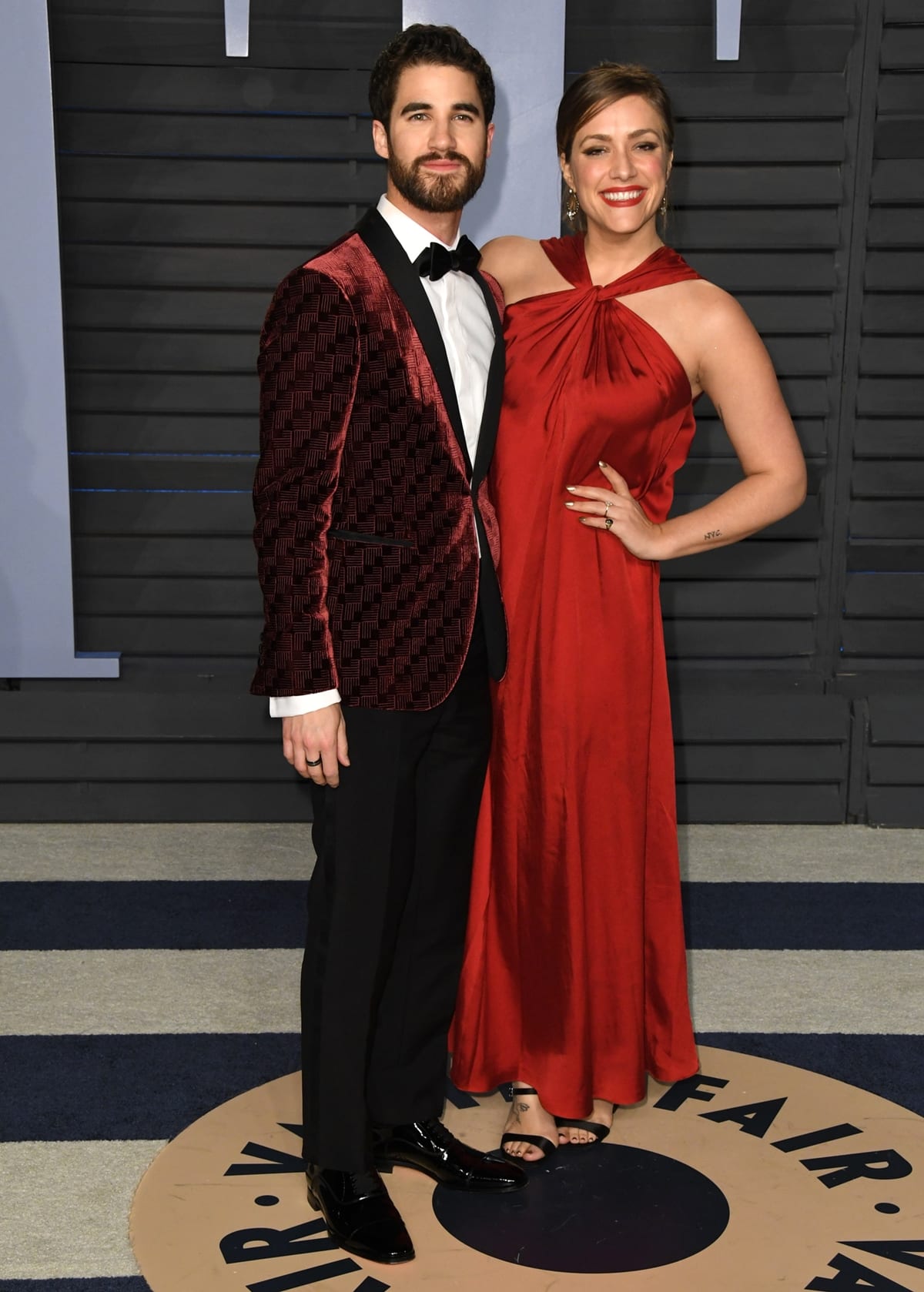Wearing an Armani suit and Christian Louboutin shoes, Darren Criss and Mia Swier attended the 2018 Elton John AIDS Foundation’s Academy Awards Viewing Party