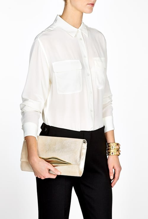 The Diane von Furstenberg 'Flirty Lips' Clutch: A statement piece with a playful, lip-shaped magnetic closure