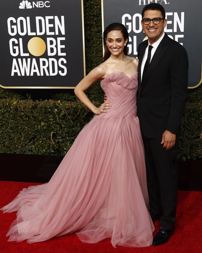 Emmy Rossum stuns in a dreamy pink Monique Lhuillier tulle ballgown, exuding effortless elegance alongside her husband, Sam Esmail, at the 2019 Golden Globe Awards