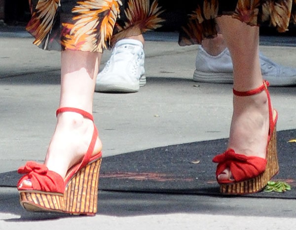 Florence Welch with her feet on display in Charlotte Olympia "Miranda" bamboo-print wedges