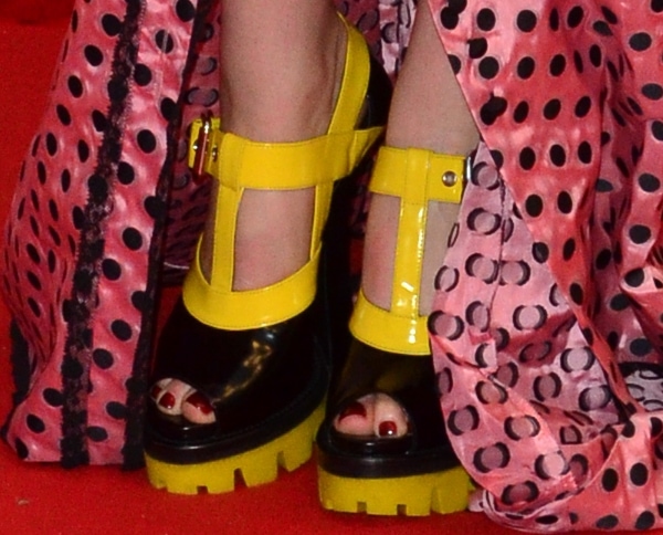 Florence Welch shows off her sexy toes in Miu Miu yellow-and-black platforms