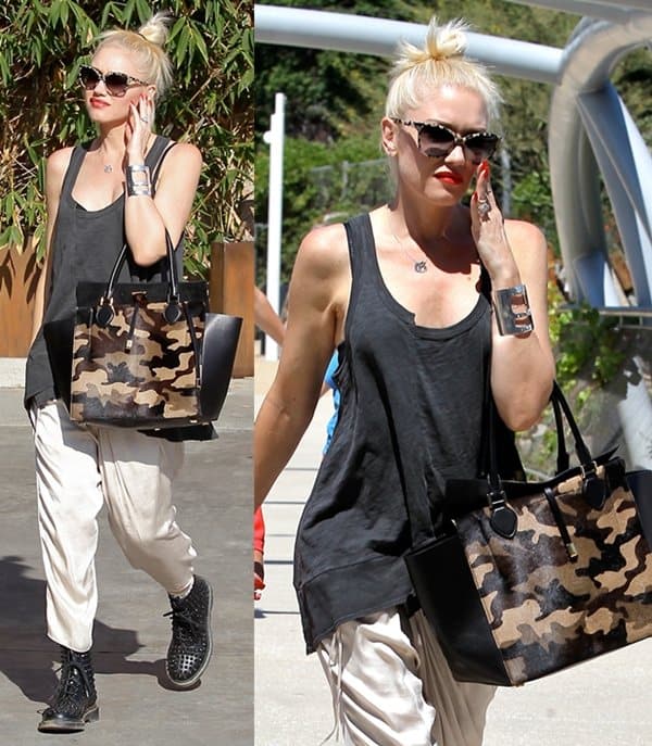 Gwen Stefani pairs harem pants with studded Doc Marten boots and a Wilt twisted tank, showcasing her unique rocker style