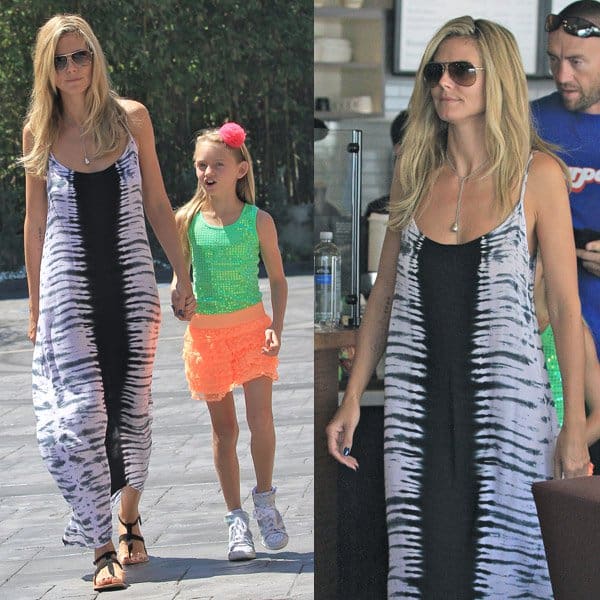 Heidi Klum keeps it effortlessly chic in a tie-dye maxi dress paired with black gladiator sandals during a sunny family outing