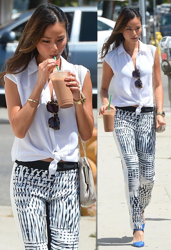 Fashionably sipping: Jamie Chung grabs a smoothie in Beverly Hills, sporting silk pants paired with a sleeveless white blouse and blue pointed-toe pumps