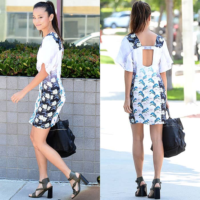 Jamie Chung elegantly blends tradition with modern style in a kimono-sleeved dress, featuring a flowing silhouette that exudes sophistication