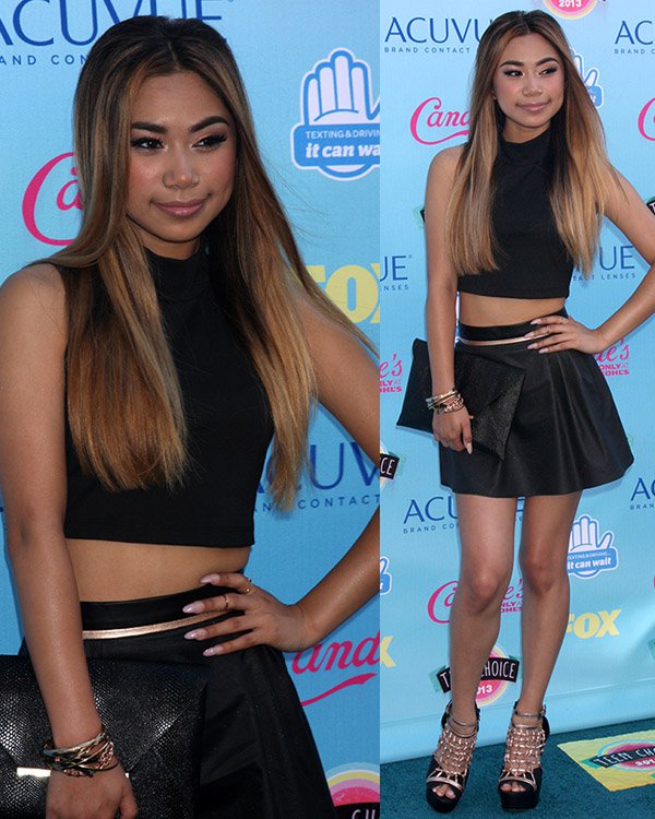 Jessica Sanchez brought daring fashion to the 2013 Teen Choice Awards with a bold crop top and miniskirt, complemented by eye-catching metallic bronze cage sandals