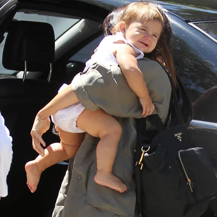Kourtney Kardashian steps out with her daughter Penelope, accessorizing with a sleek Prada baby bag