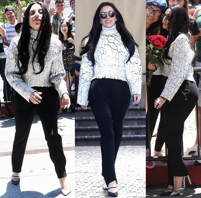 Lady Gaga makes a striking appearance in a textured white marbled sweater and sleek black trousers