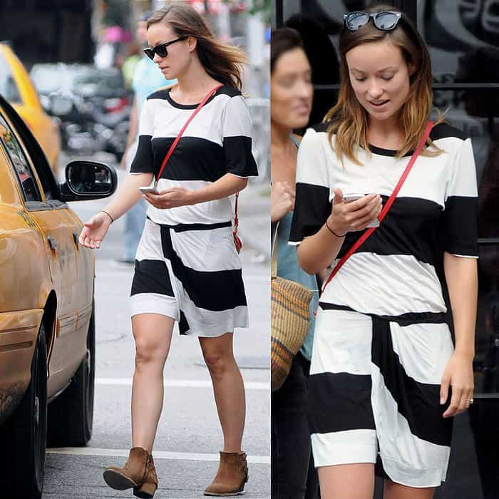 On August 2, 2013, in New York City, Olivia Wilde was spotted wearing Ray-Ban Original Wayfarer 2140 sunglasses, an A.L.C. striped short sleeve drape skirt dress, a Rovimoss First Class Mini Square crossbody bag, and H by Hudson Encke ankle boots