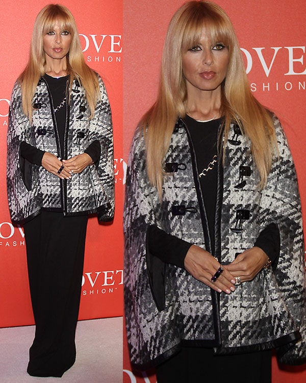 Rachel Zoe elegantly hosts the Covet Fashion launch event in SoHo, New York City, wearing a sophisticated herringbone knit capelet trimmed with faux leather
