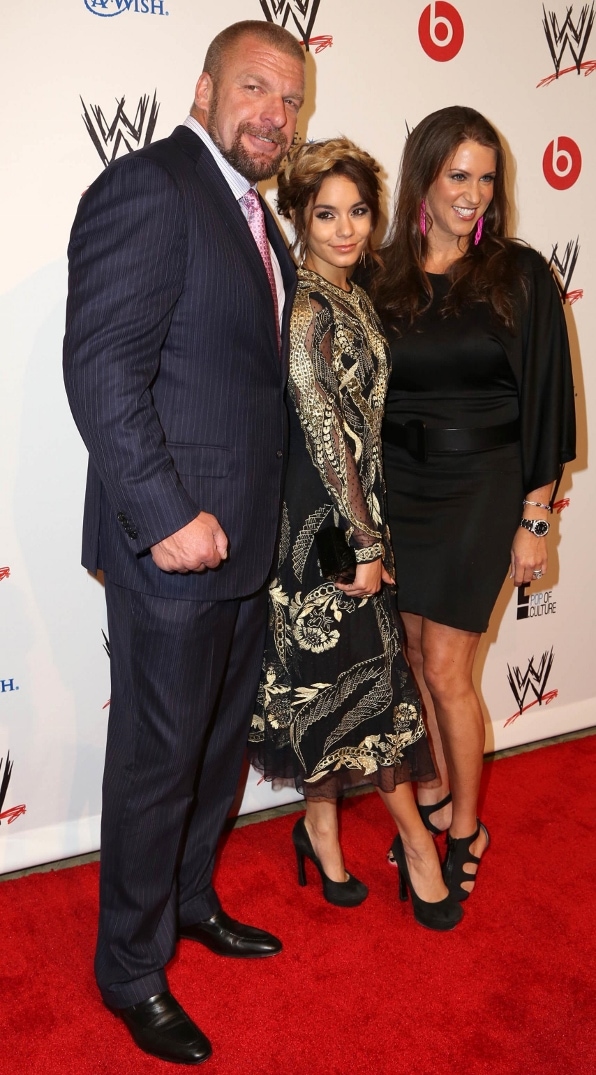 Vanessa Hudgens with Paul Levesque (Triple H) and wife Stephanie McMahon at the WWE charity event