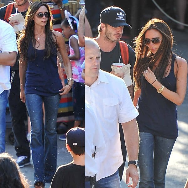 Victoria Beckham stylishly pairs blue flare jeans with a chic black top
