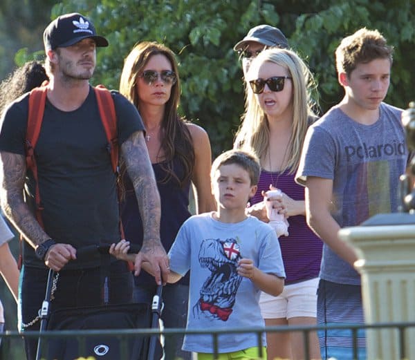 Victoria Beckham enjoys a family day out with David Beckham and their children at Disneyland, Anaheim, on August 22, 2013