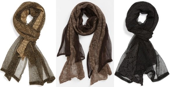The "Thick and Thin" scarf is crafted from lush knitwork and fashioned with metallic gossamer overlay for added drama