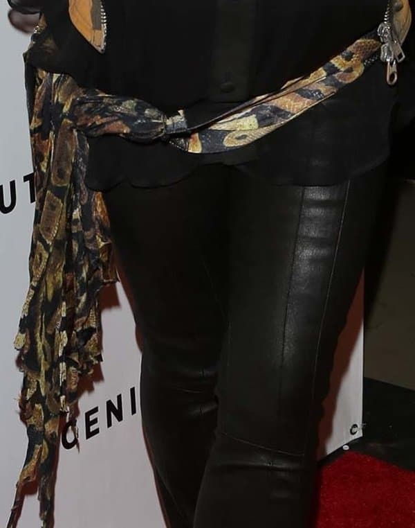Fergie adds drama to her ensemble with a creatively styled scarf belt at the 'Scenic Route' premiere