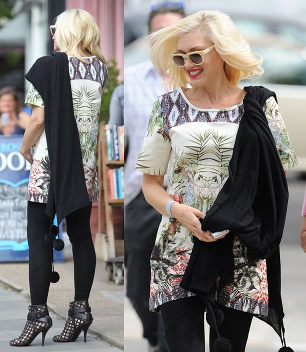 Gwen Stefani confidently sports a pom-pom trim stole over a beautifully printed dress, complemented by cage booties, during a stylish outing in Primrose Hill, London, on August 19, 2013
