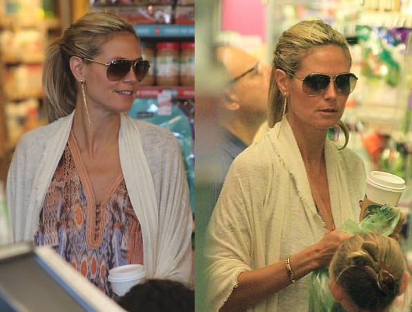 Heidi Klum spends the day with her kids in Brentwood while sporting a printed caftan and a white scarf on August 11, 2013