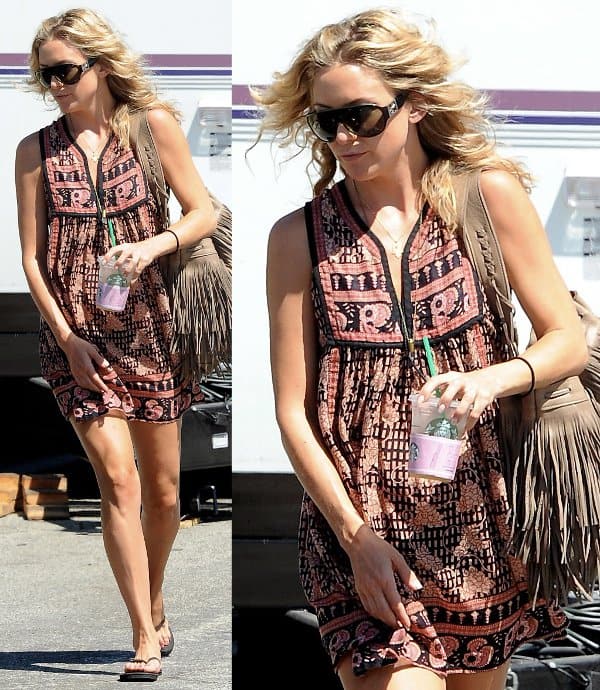 Spotlight on Style: Kate Hudson dons a hippie-inspired ensemble, pairing a delicately embroidered dress with a fringed bag by Two Bar West, on set in Los Angeles
