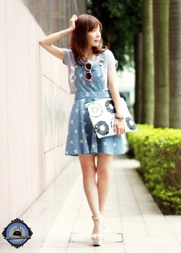 Prisca styled her cross-print denim dress with a graphic tee