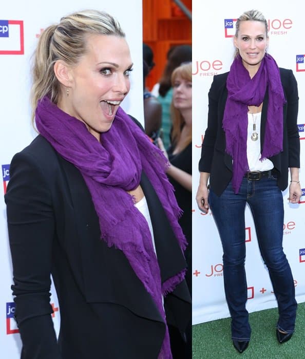 Molly Sims wearing a purple scarf at the JCPenney + Joe Fresh Kids Orange Grove event held at Times Square in New York City, on August 21, 2013