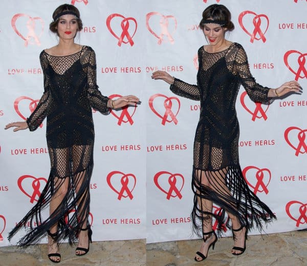 Channeling the classic flapper, Nicole Trunfio models a beaded black gown with elegant fringed detailing at the Love Heals benefit