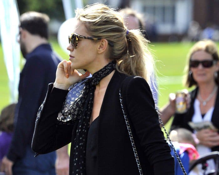 Abigail Marie Clancy was seen wearing a printed scarf around her neck and stylish sunglasses