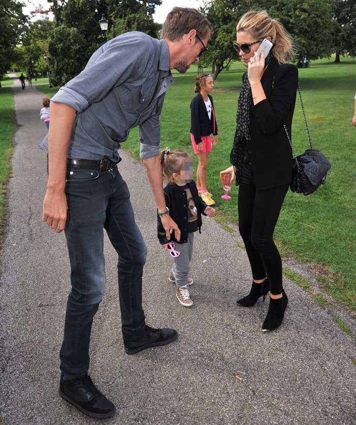 Peter Crouch, Abigail Marie Clancy, and Sophia Ruby Crouch attend the Pup Aid 2013 dog show held at Primrose Hill in London
