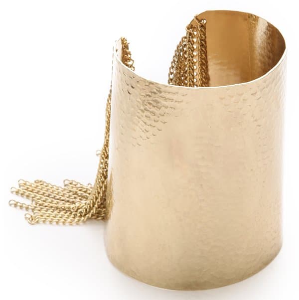 Chain fringe boosts the dramatic look of a hammered cuff with a high-gloss finish.