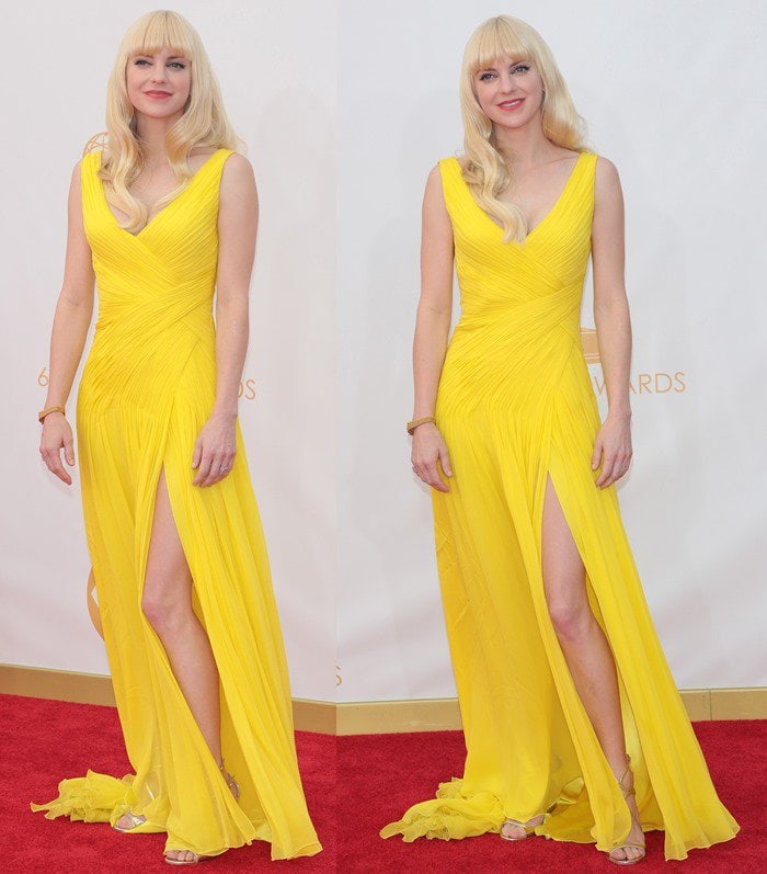 Anna Faris stuns in a bright yellow Monique Lhuillier gown paired with gold Jimmy Choo sandals, showcasing how to make a bold color pop effortlessly on the red carpet