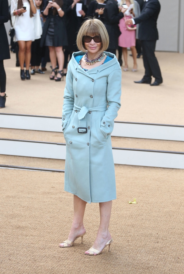 Anna Wintour looks flawless in a pale blue coat with off-shoulder details