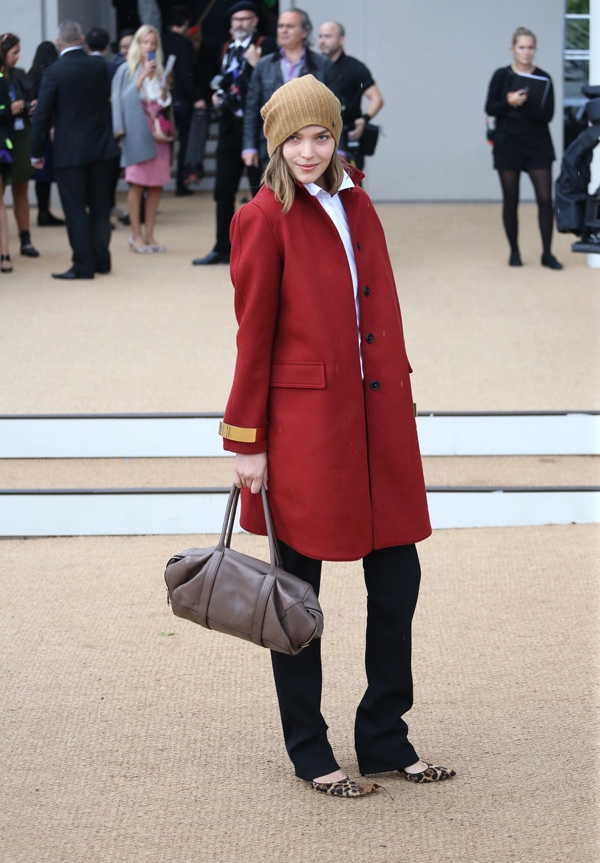 Arizona Muse grabs attention in a red coat and leopard-printed shoes