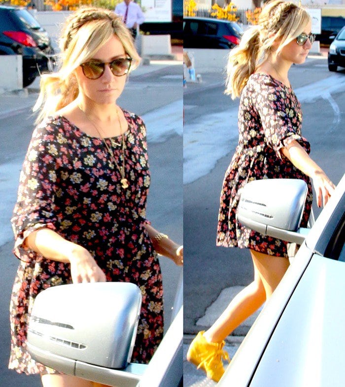 Ashley Tisdale wearing bright yellow sneakers with her floral dress while shopping around Beverly Hills on September 19, 2013