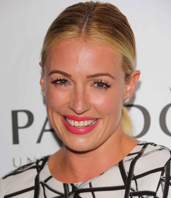 Cat Deeley's lippy, nail polish, and soft makeup