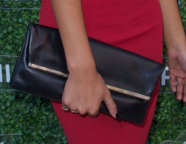 Completing her look, Chanel Iman opts for sophisticated black strappy heels, perfect for the fashionable affair