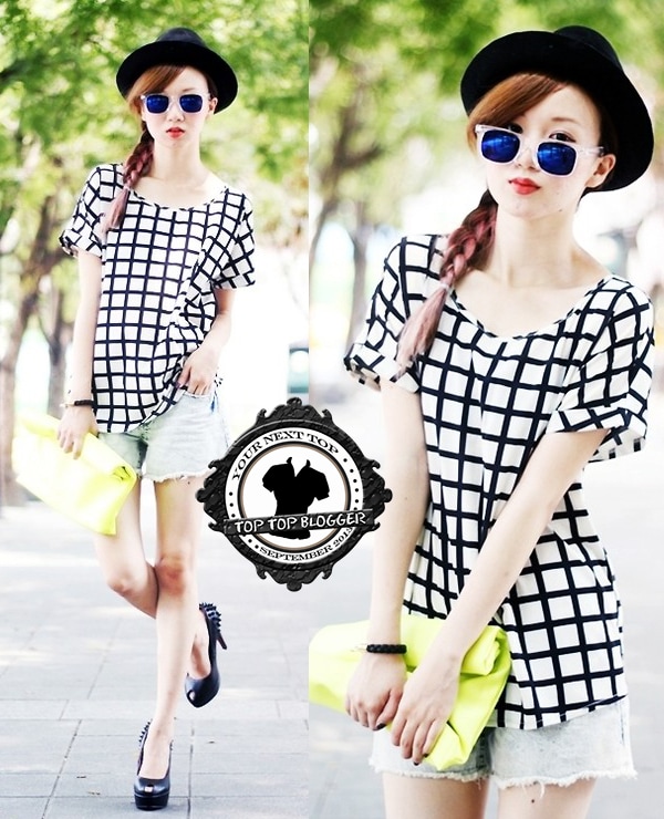 Crystii wears a stylish black and white checkered top