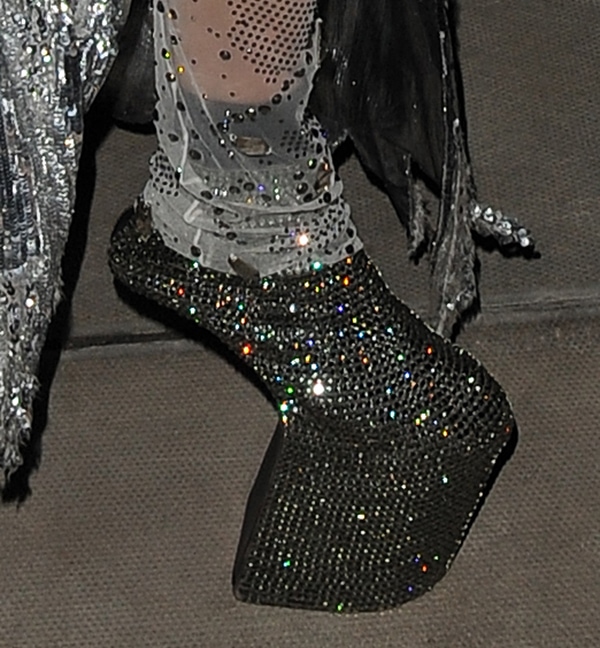 Daphne Guinness shows off her crystal-embellished heel-less shoes