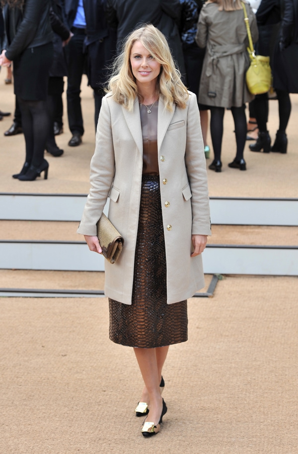 Donna Air looks chic in a taupe coat with a stylish ensemble underneath