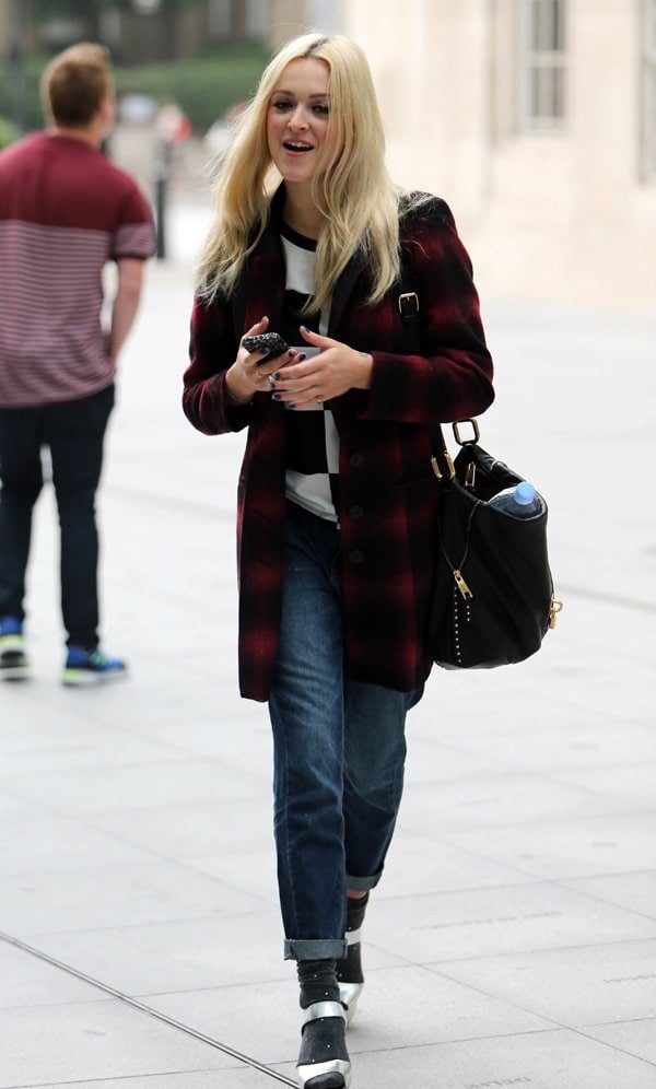 Fearne Cotton was definitely prepared for the bite in the air as she was wrapped up in a cozy-looking wool tartan coat
