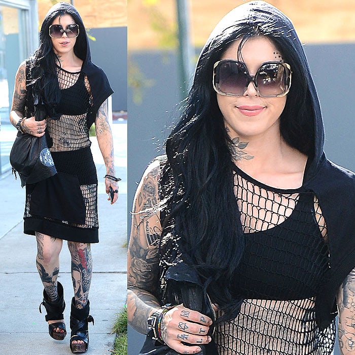 Embrace a bold, daring look by pairing a black mesh dress with a hooded vest, platform sandals, oversized sunglasses, and minimal accessories for a chic, edgy vibe that turns heads