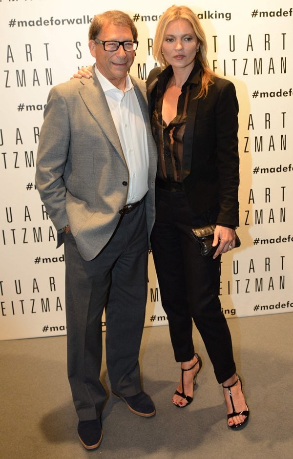 Kate Moss poses with designer Stuart Weitzman at the Stuart Weitzman flagship store opening