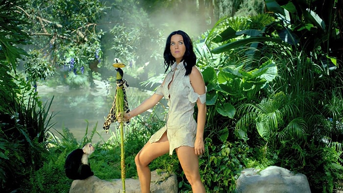 Katy Perry using a shoe heel as the tip of her spear in the "Roar" official music video