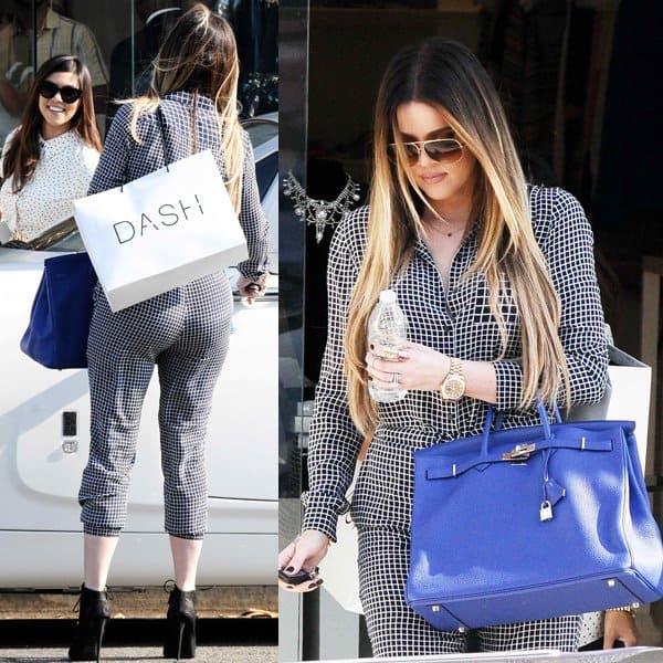 On September 9, 2013, in Los Angeles, Khloé Kardashian showcased her chic style in a Theory Daranda silk jumpsuit, complemented by Giuseppe Zanotti Alien studded lace-up ankle boots and accessorized with a navy blue Hermès Birkin bag