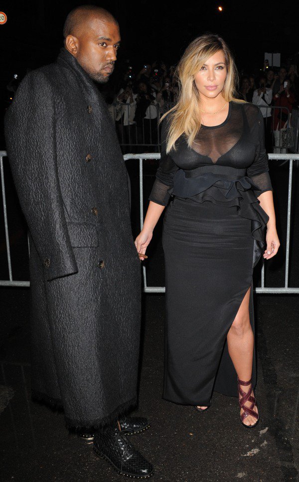 Kim Kardashian and Kanye West both wearing black to the Givenchy presentation at Paris Fashion Week