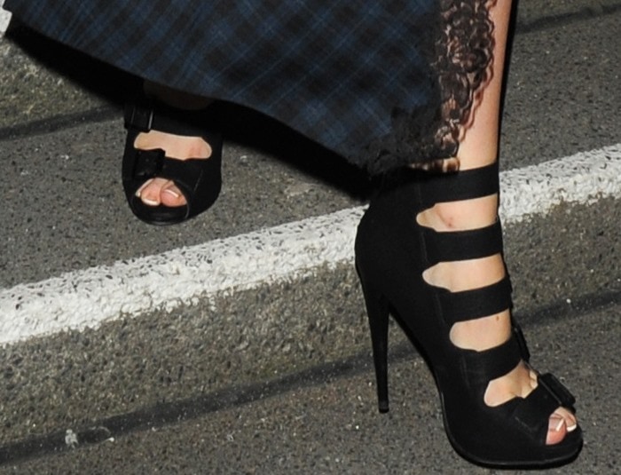 Laura Whitmore shows off a French pedicure in an edgy pair of buckled heels